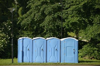 row of portable toilets out side