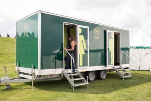 luxury porta potty trailer at an event outdoors